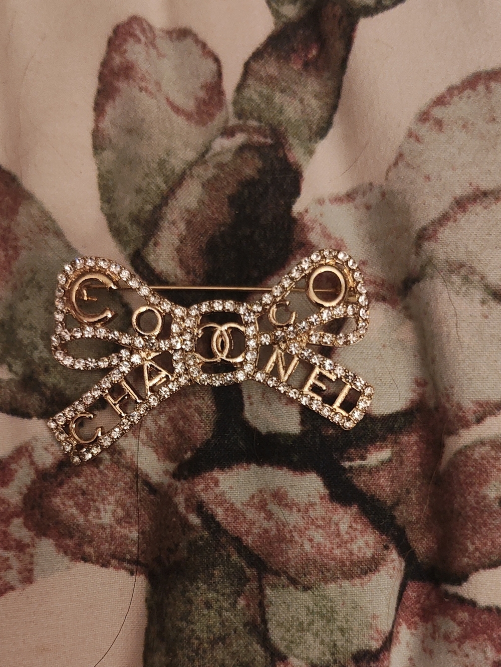 Luxury Crystal Bow Brooch in Gold with Logo Accents